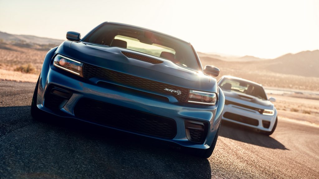 2020 Dodge Charger SRT Hellcat Widebody (Front) and 2020 Dodge Charger Scat Pack Widebody (Rear). Two premiere muscle cars under the Dodge brand.