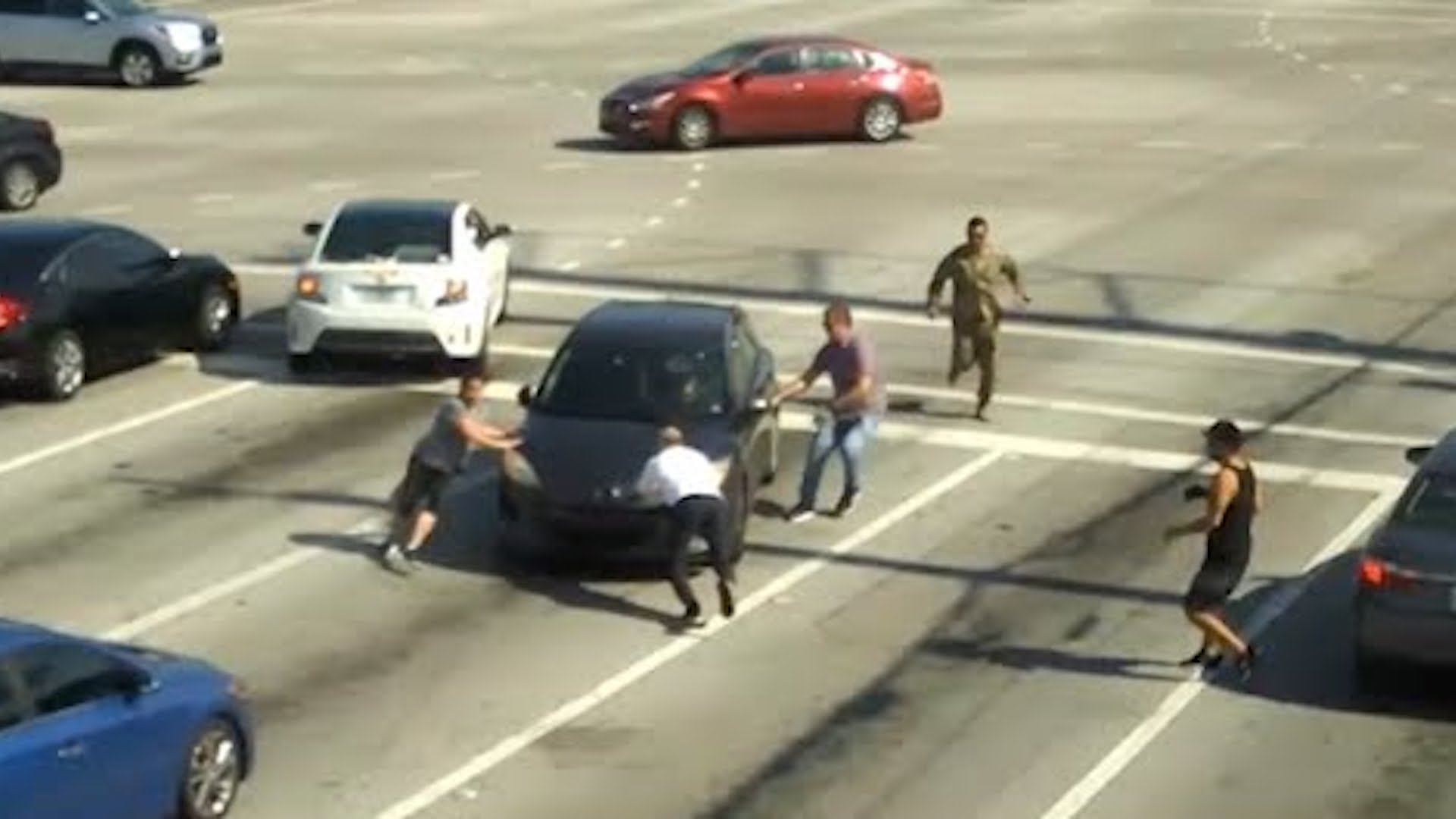 Heroic Bystanders Use Bare Hands to Rescue Woman in Runaway Car