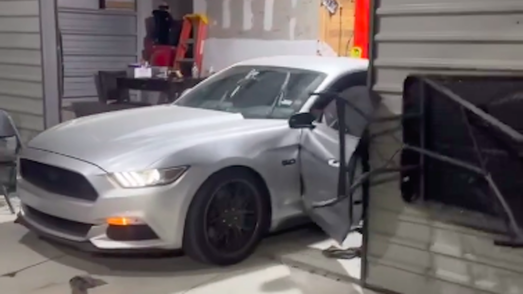 Ford Mustang Driver Smashes His Open Door Into a Garage