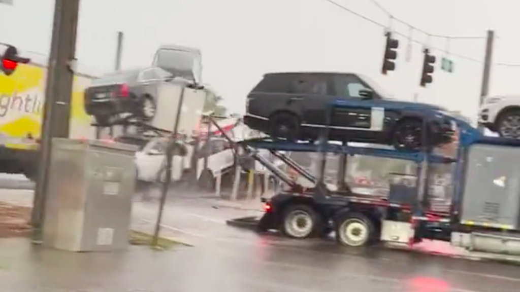 Train Accident crashing onto a car hauler