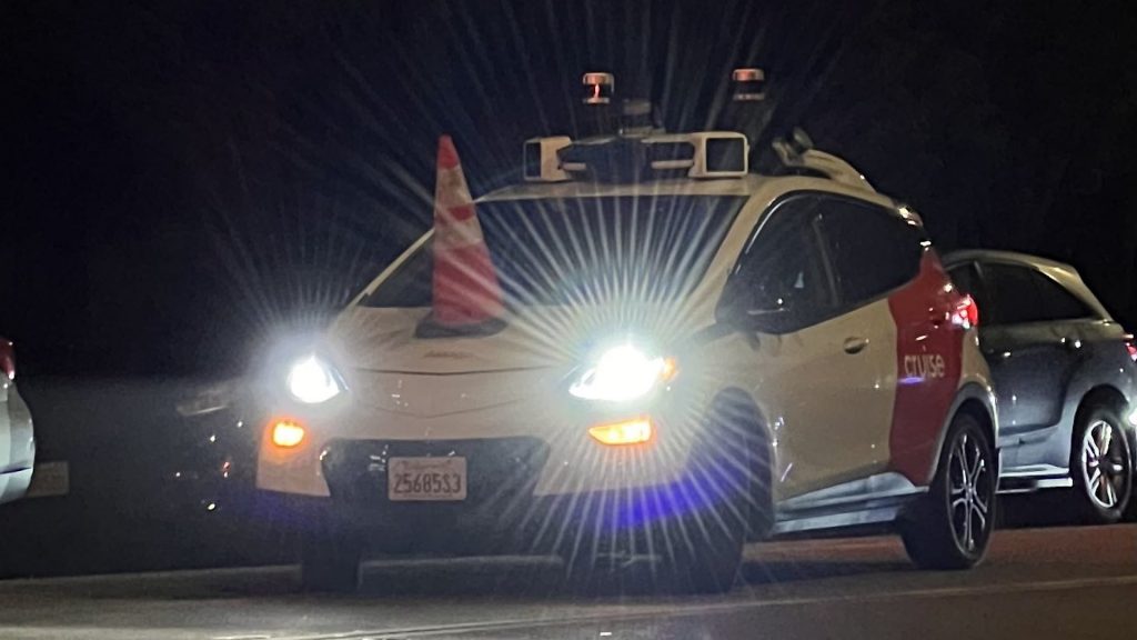 Robotaxi spotted with a traffic cone over its hood's sensor