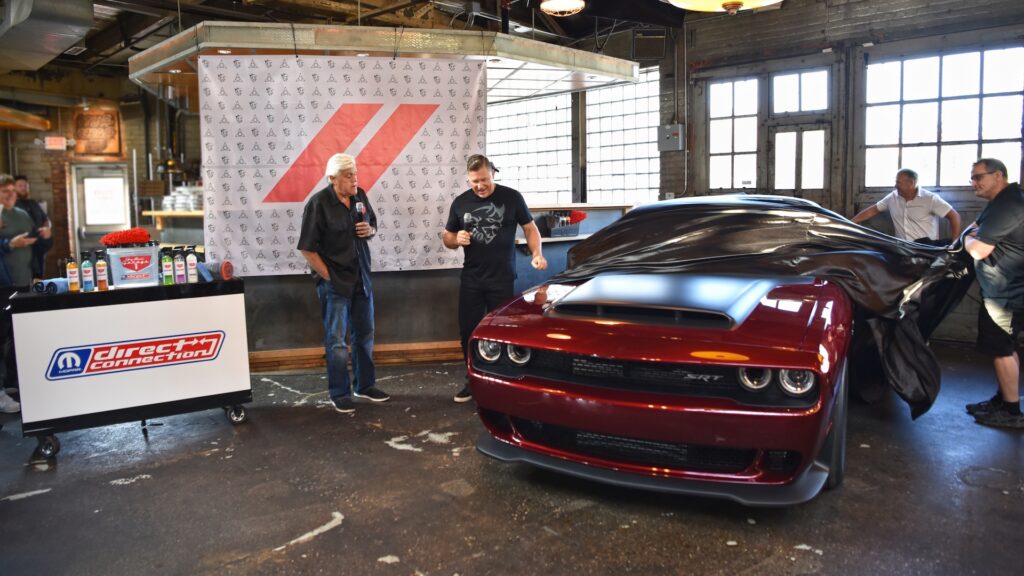 Dodge Brand CEO Tim Kuniskis surprises Jay Leno with the keys to the iconic comedian’s 1,025 horsepower 2023 Dodge Challenger SRT Demon 170 during a press conference to announce a new line of co-branded car care products from Direct Connection and Jay Leno’s Garage on August 19, 2023. The surprise presentation represented the first customer delivery of the Dodge Challenger SRT Demon 170, the fastest, quickest, most powerful factory muscle car in the world.